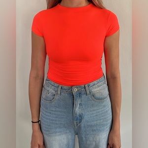 NEON pink bodysuit with high cut short sleeve